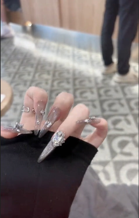 Glamorous artificial nails with rhinestone accents Stornfield