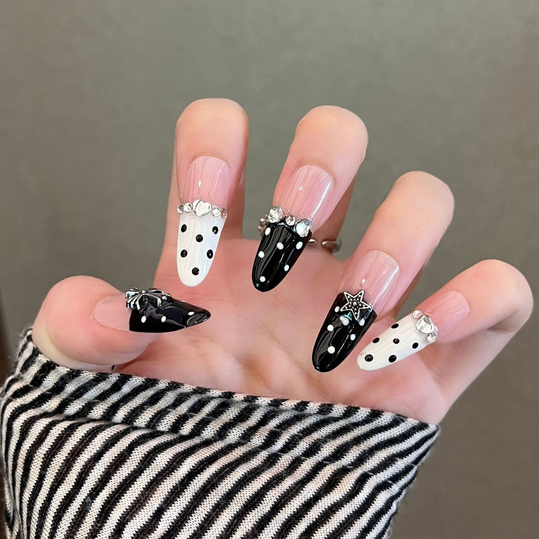 Artistic Stiletto Press-On Nail Art with Glimmering Accents Stornfield