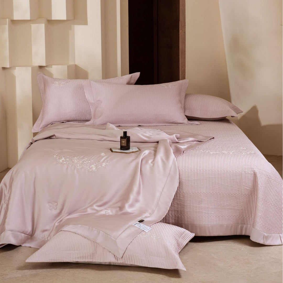 Luxurious cotton satin bedding set with quilted bedspread and floral embroidery