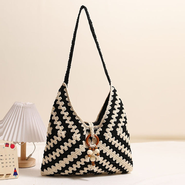 Handmade macrame shoulder bag with playful pendant Stornfield