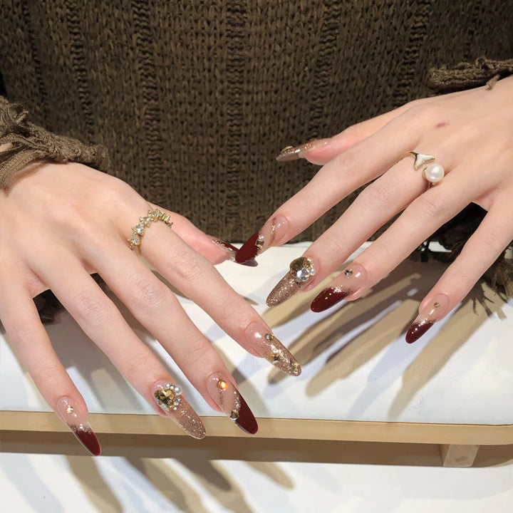Acrylic nail set with elegant glitter design and exclusive embellishments Stornfield