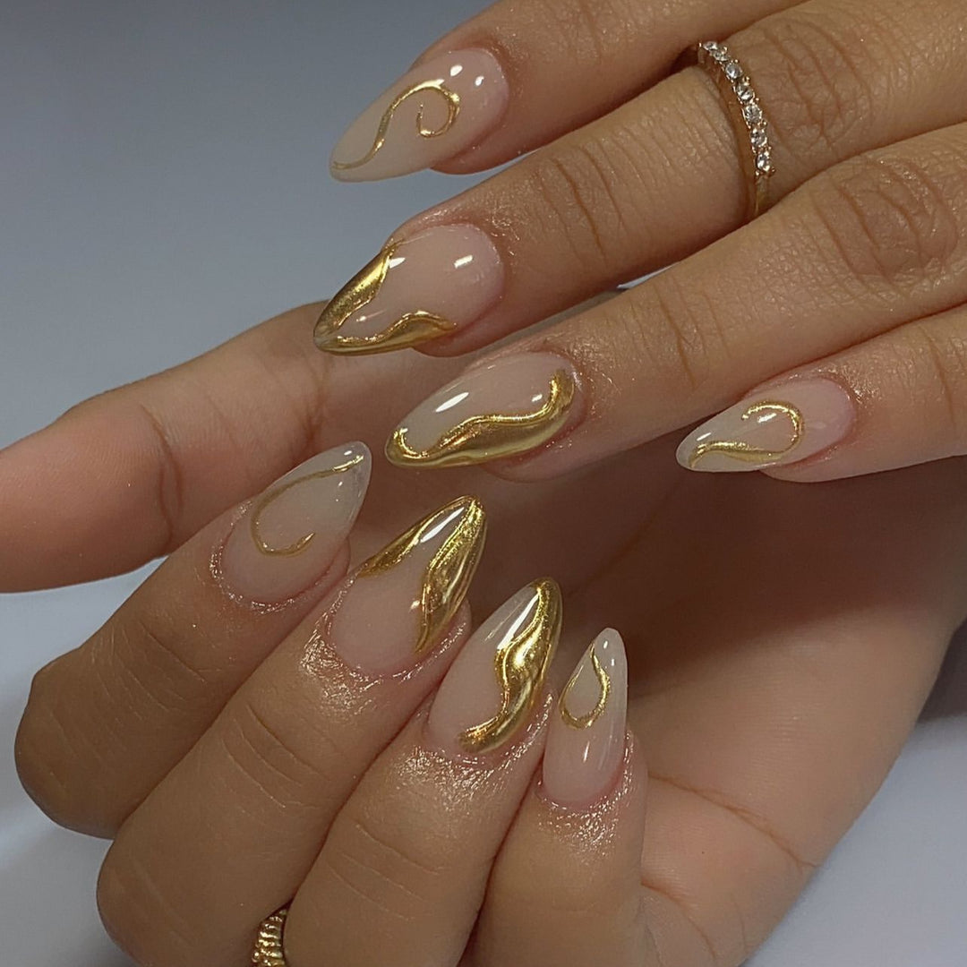 Artistic Stiletto Nails with Elegant Gold Accents Stornfield