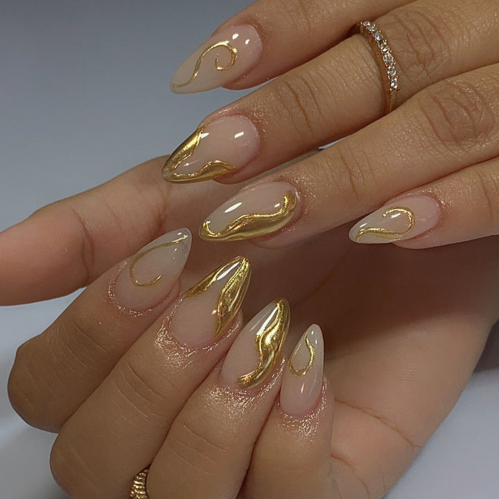 Artistic Stiletto Nails with Elegant Gold Accents Stornfield