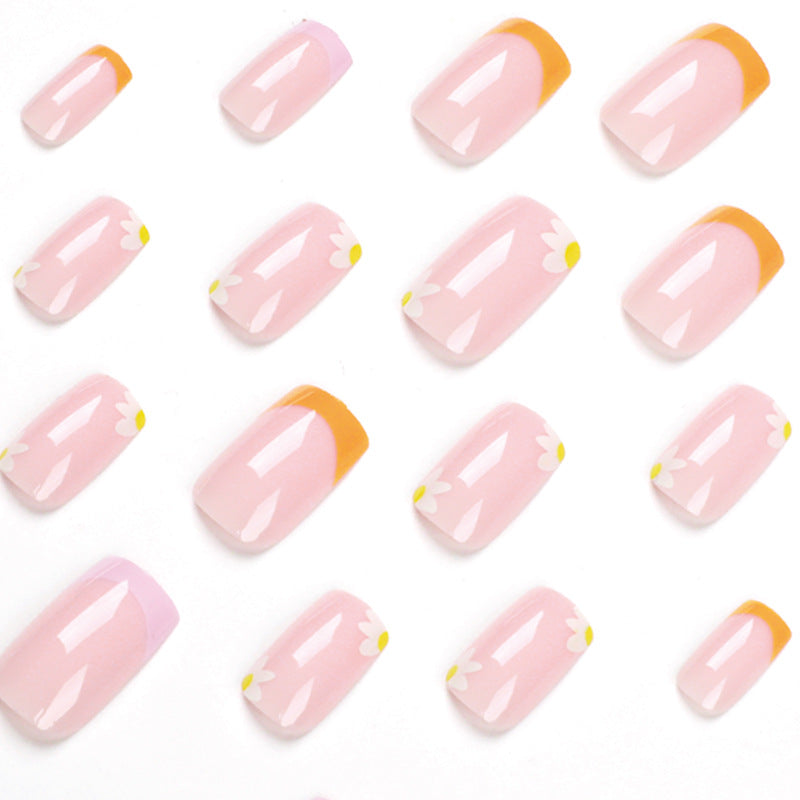 Artistic acrylic nails with floral design and creative color accents Stornfield