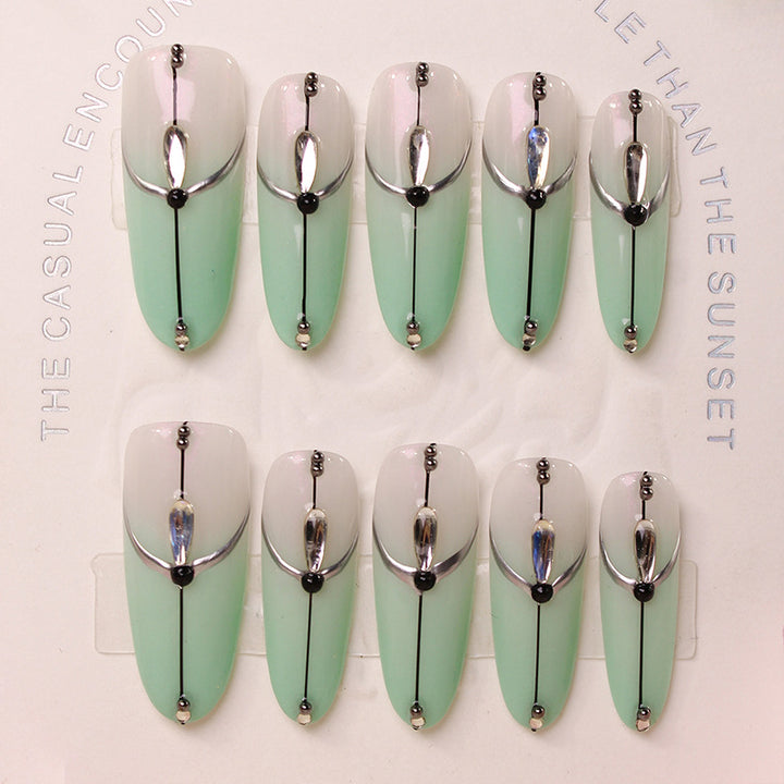 Acrylic nail set with elegant ombre effect and glamorous embellishments Stornfield