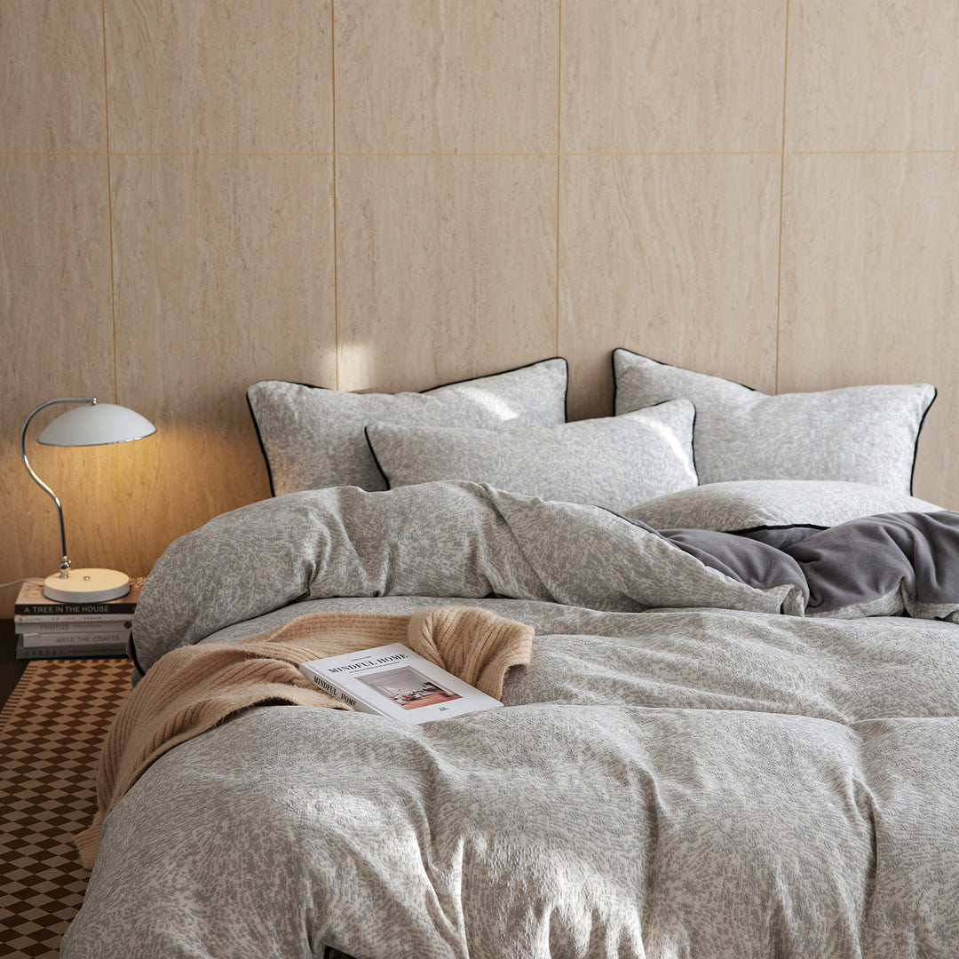 Premium bedding set made of breathable cotton blend with contrast piping