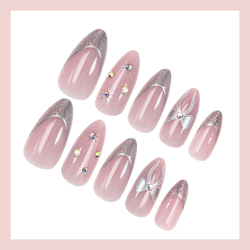 Artificial nail set with glamorous glitter and flower accents Stornfield