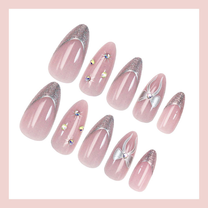 Artificial nail set with glamorous glitter and flower accents Stornfield