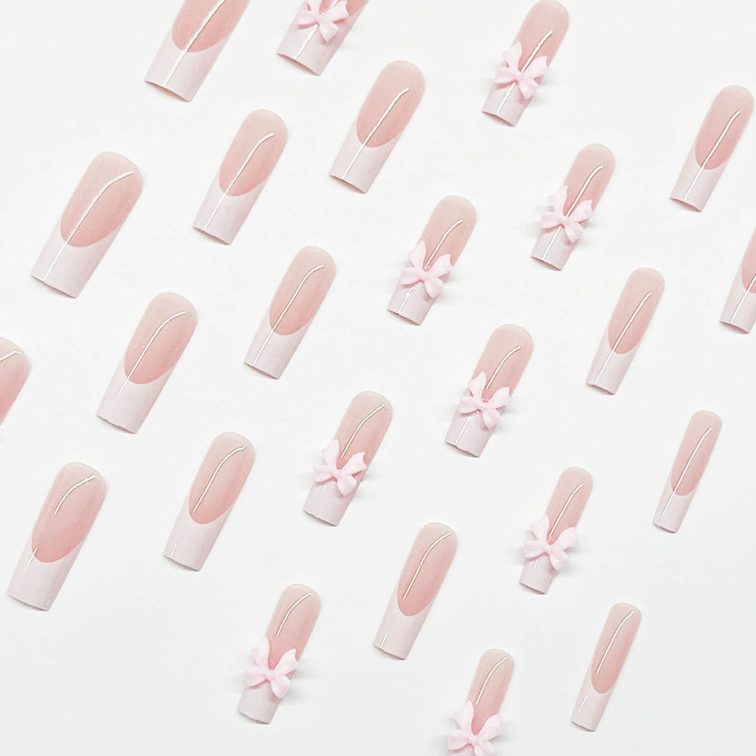 Artificial nails with playful bow design Stornfield