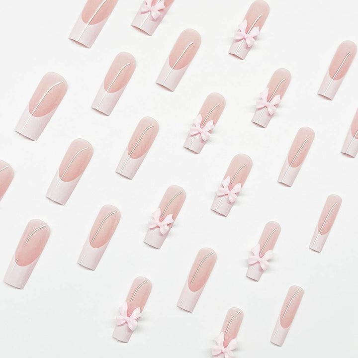 Artificial nails with playful bow design Stornfield