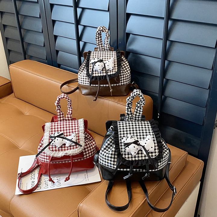 Playful backpack with checkered pattern and animal appliqué Stornfield