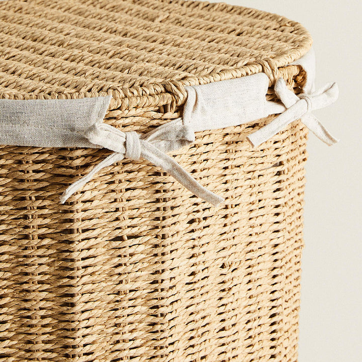 Round laundry basket made of natural materials Stornfield
