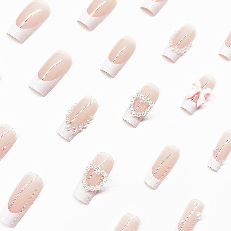 Artificial nail set with elegant 3D flowers and pearl embellishments Stornfield