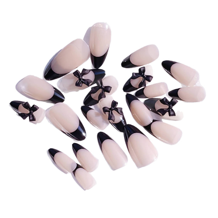 Artistic Stiletto Press-On Nail Design with Bow Accents Stornfield