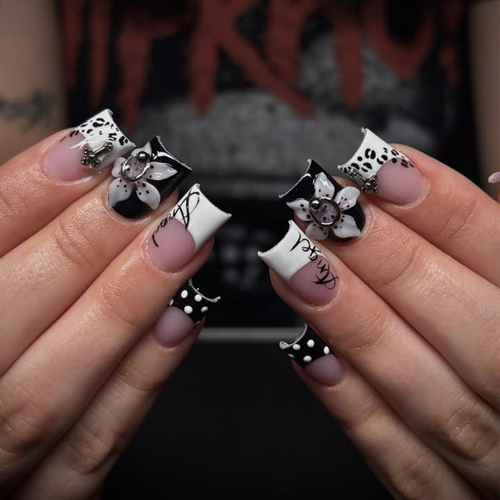 Artful nail extensions with elegant black-and-white design Stornfield