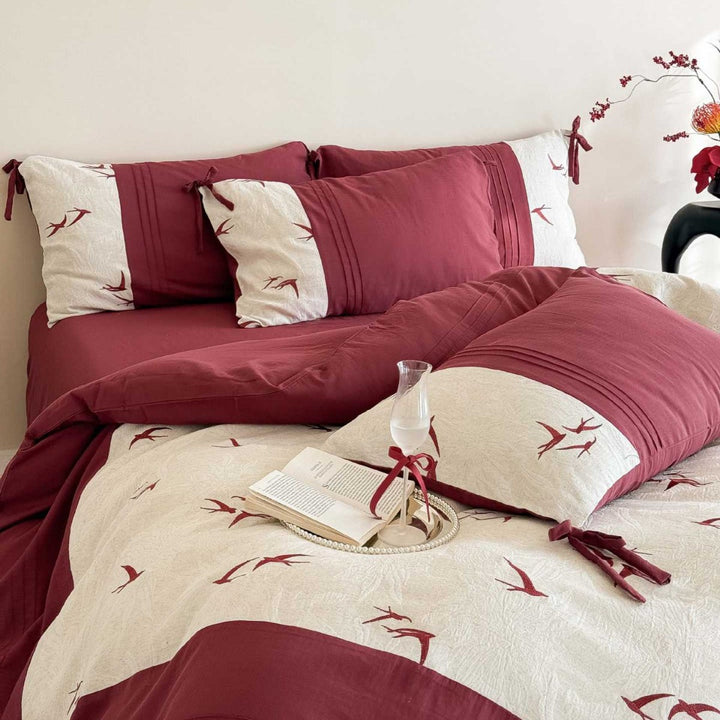 Luxurious cotton bedding set with swallow embroidery and bow accents
