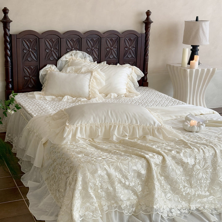 Elegant satin bedding set with double-layer chiffon ruffle and floral relief embroidery