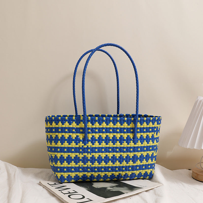 Braided straw bag with color-contrasting stripes Stornfield