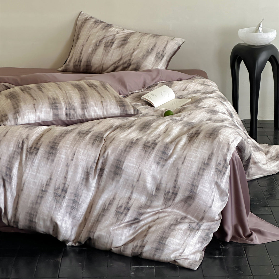 Luxurious satin bedding set with floral watercolor print, ruffled edges and reversible function