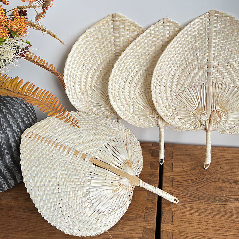 Women hand-woven fan made of natural material Stornfield