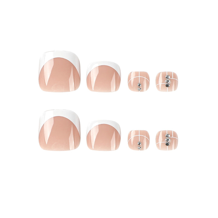 Artful toenail design with elegant style and rhinestone embellishments Stornfield
