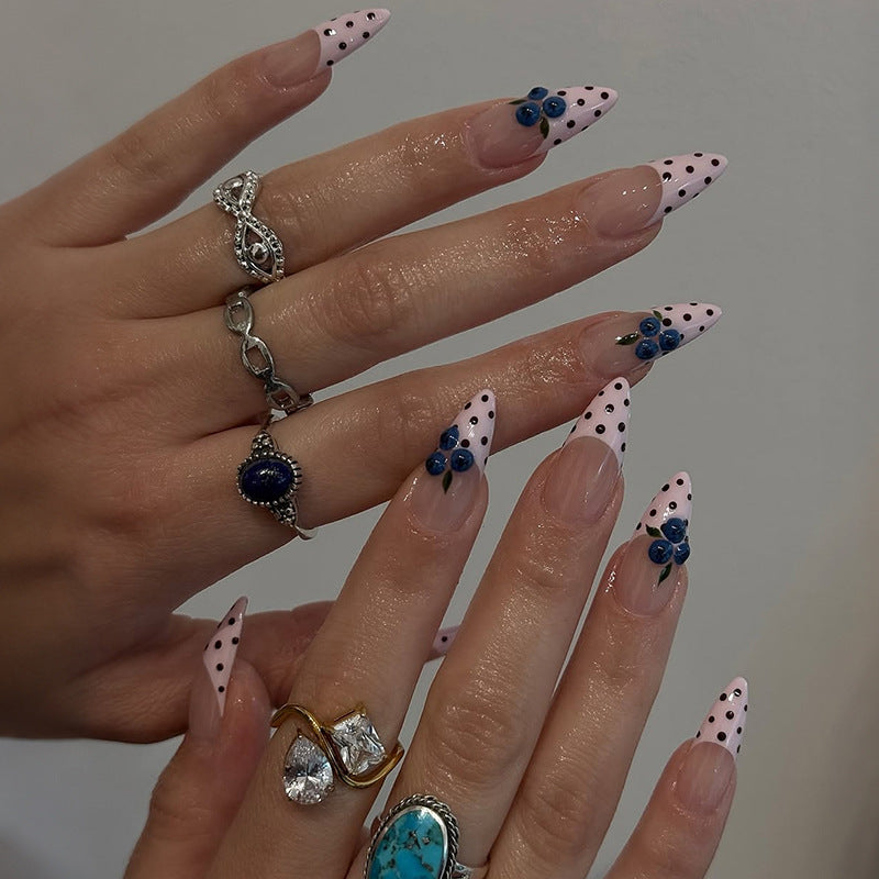 Acrylic nail set with stylish dots and floral embellishments Stornfield
