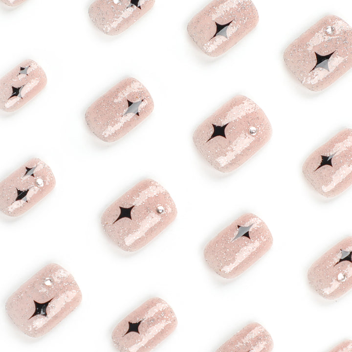 Artful Nail Extensions with Glitter and Star Pattern Stornfield