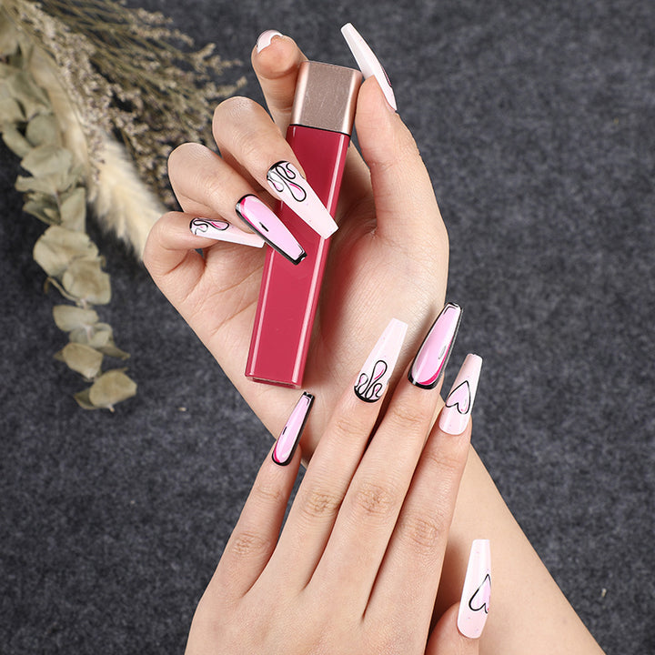 Eye-catching artificial nails with soulful heart design and glamorous accents Stornfield