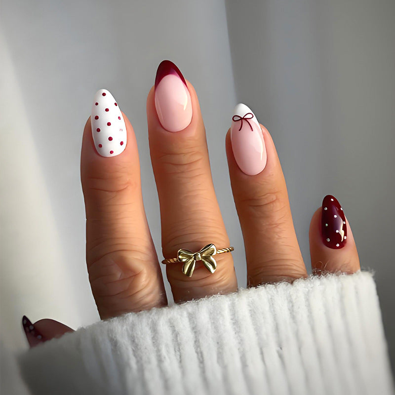 Artificial nail set with elegant bow and dot motifs Stornfield