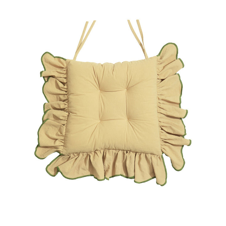 Padded chair cushion with ruffle and fastening bands
