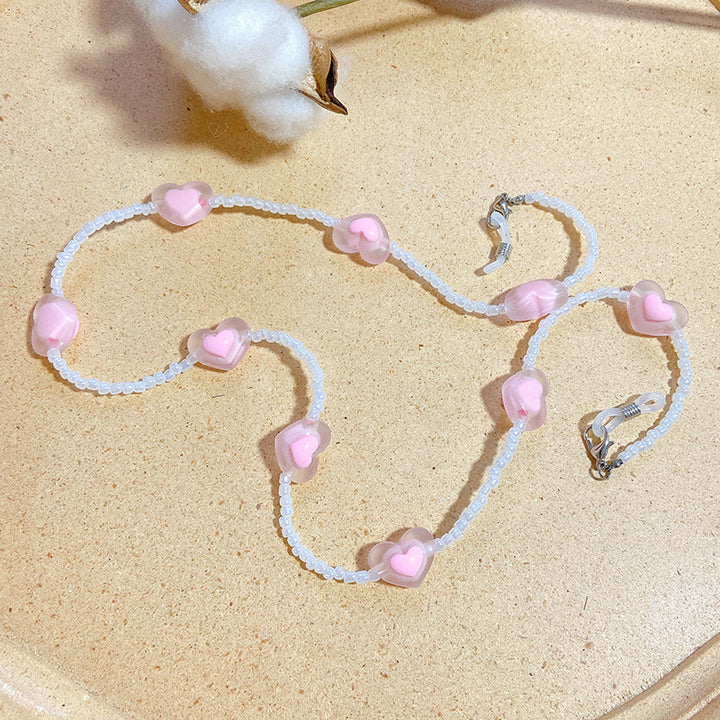 Fashionable glasses strap with heart pendants Stornfield