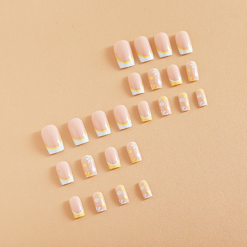 Nail art set with creative floral designs and elegant French finish Stornfield