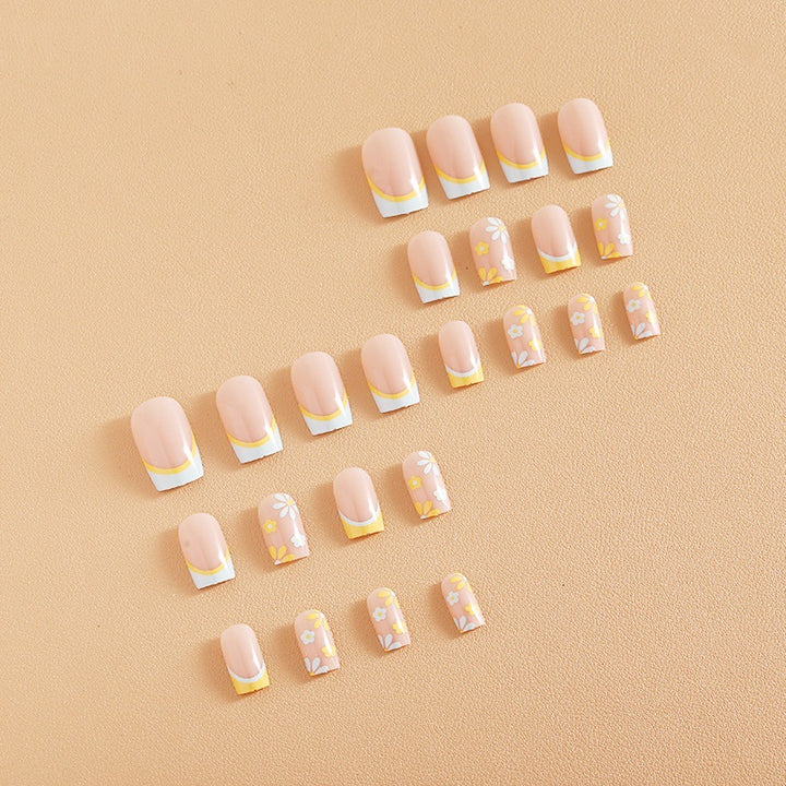 Nail art set with creative floral designs and elegant French finish Stornfield
