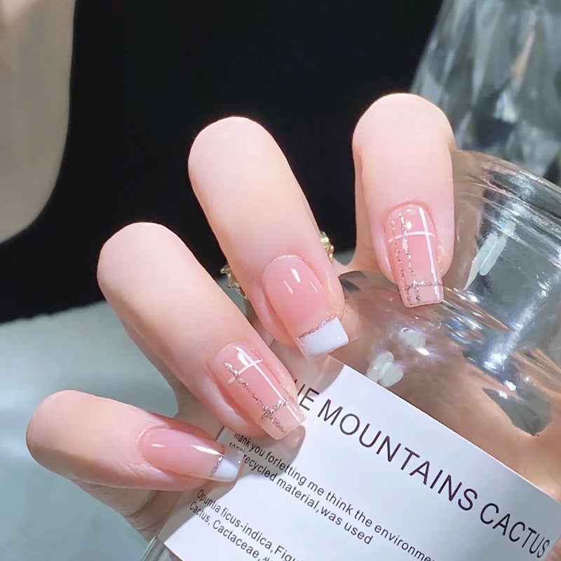 Nail set with elegant French tip and fashionable embellishments Stornfield
