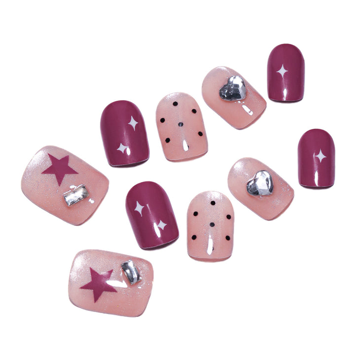 Artificial nail extensions with unique jewelry accents Stornfield