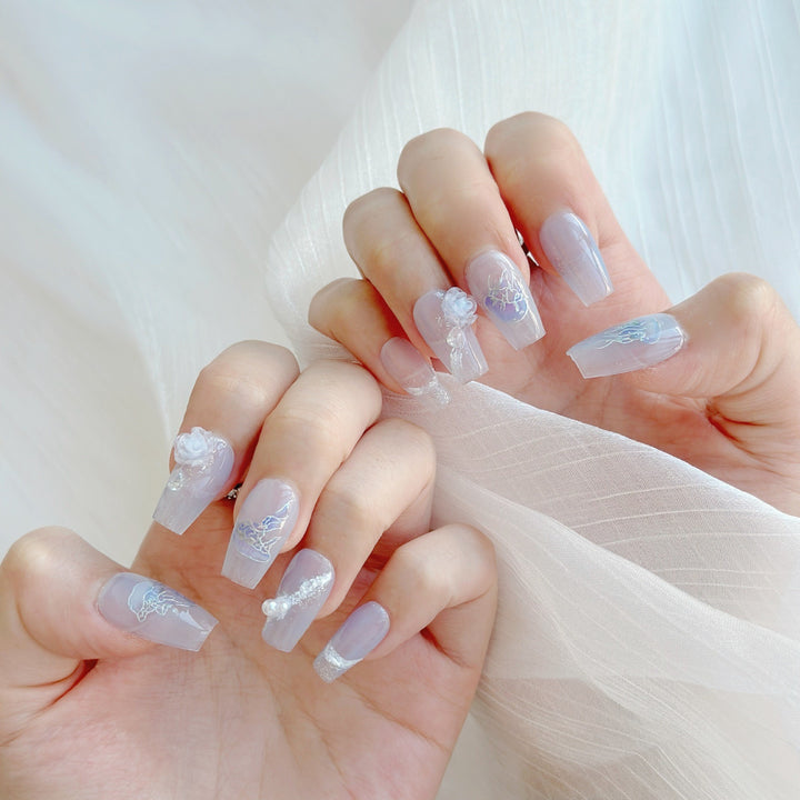 Artistic Press-On Nail Set with Sea-Inspired Designs