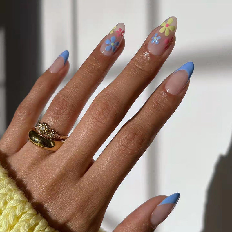 Artificial nail art with floral design and gradient Stornfield