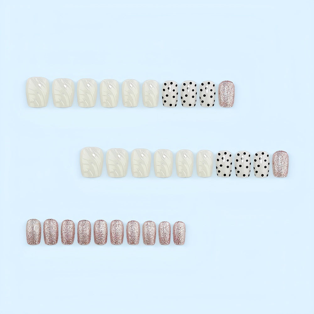 Artificial nail set with elegant glitter and dot design Stornfield