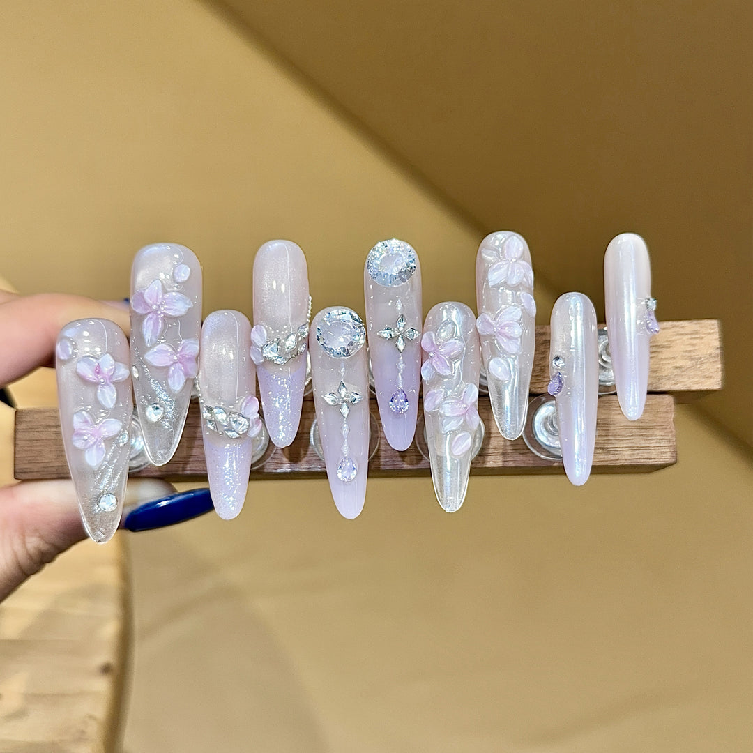 Artificial nails with delicate flower design and glitter accents Stornfield