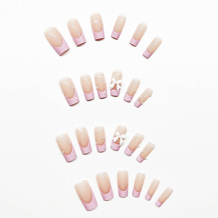 Artificial nail set with romantic bow and pearl embellishments Stornfield