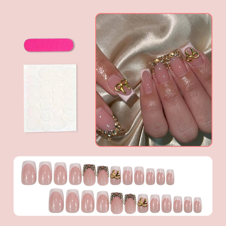 Artificial nail set with elegant gold embellishments Stornfield