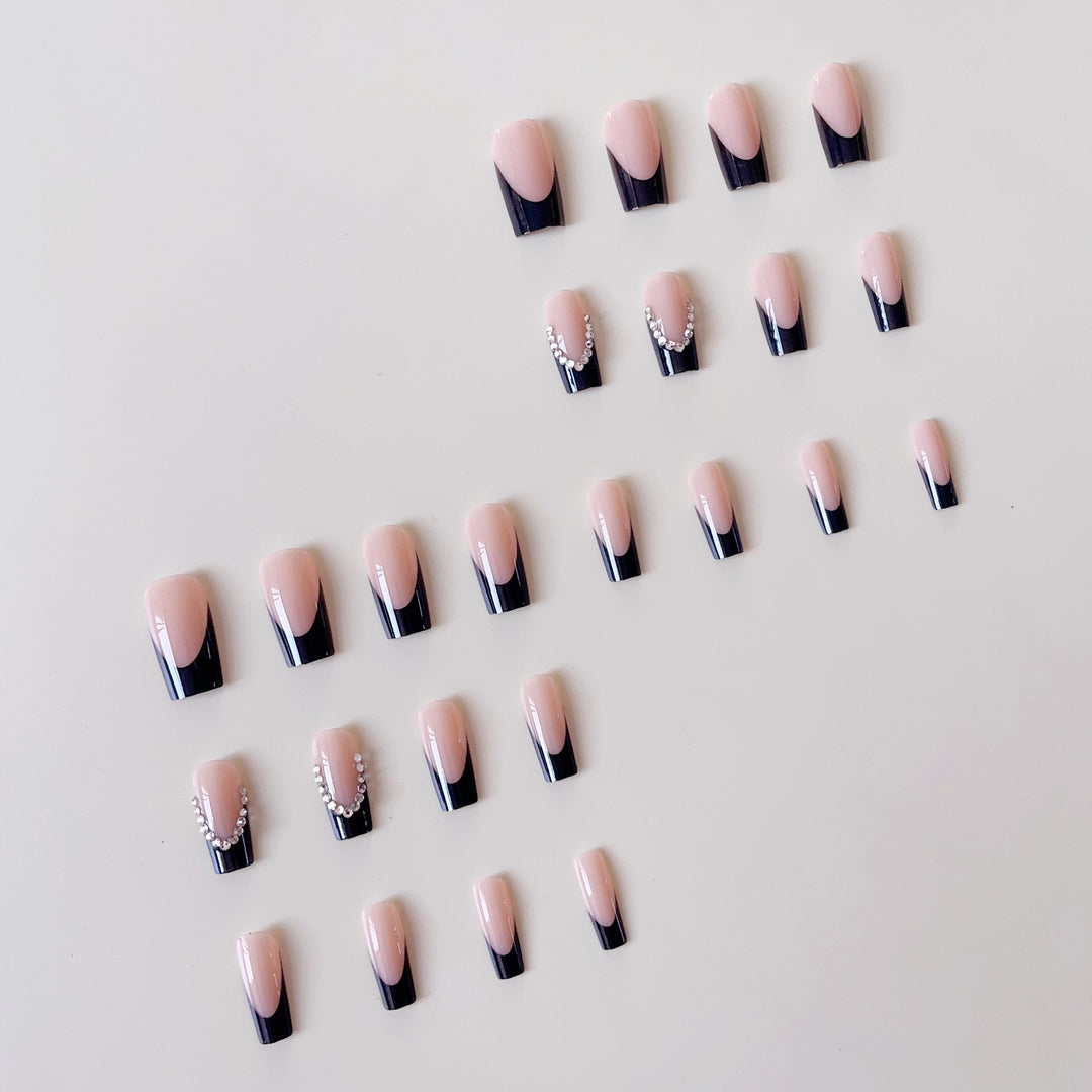 Artificial nail set with elegant tips and glitter accents Stornfield