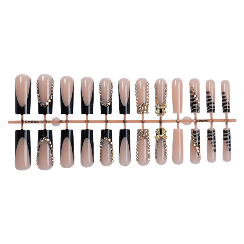 Acrylic nail set with glamorous 3D bows and radiant rhinestone decorations Stornfield