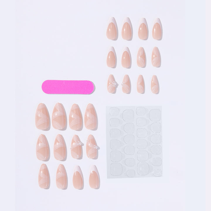 Creative acrylic nail set with elegant tips and glitter decorations Stornfield