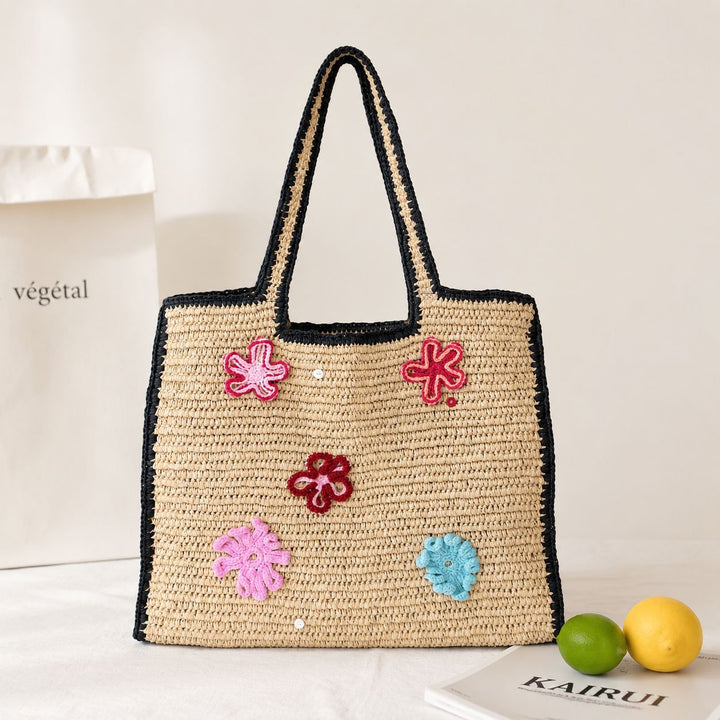 Handmade straw bag with flower appliqués Stornfield