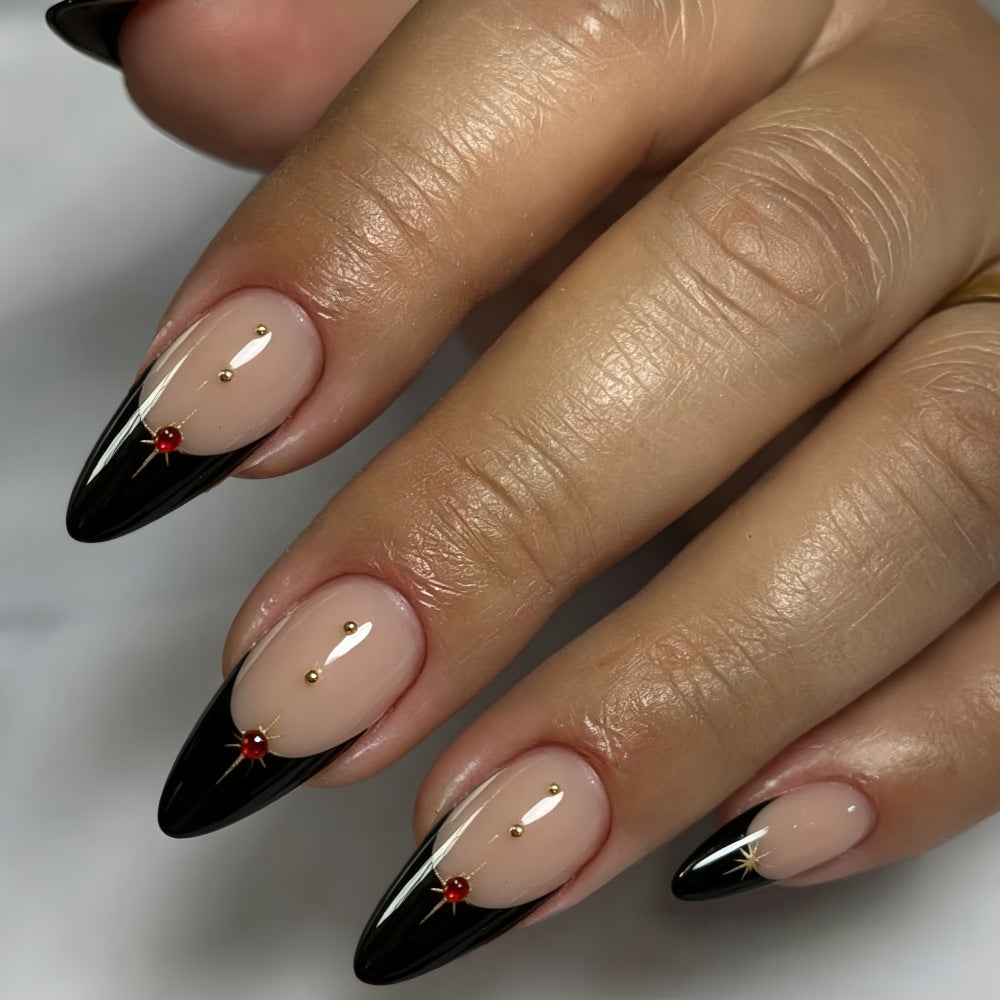 Glamorous artificial nails in stylish stiletto design with golden accents Stornfield