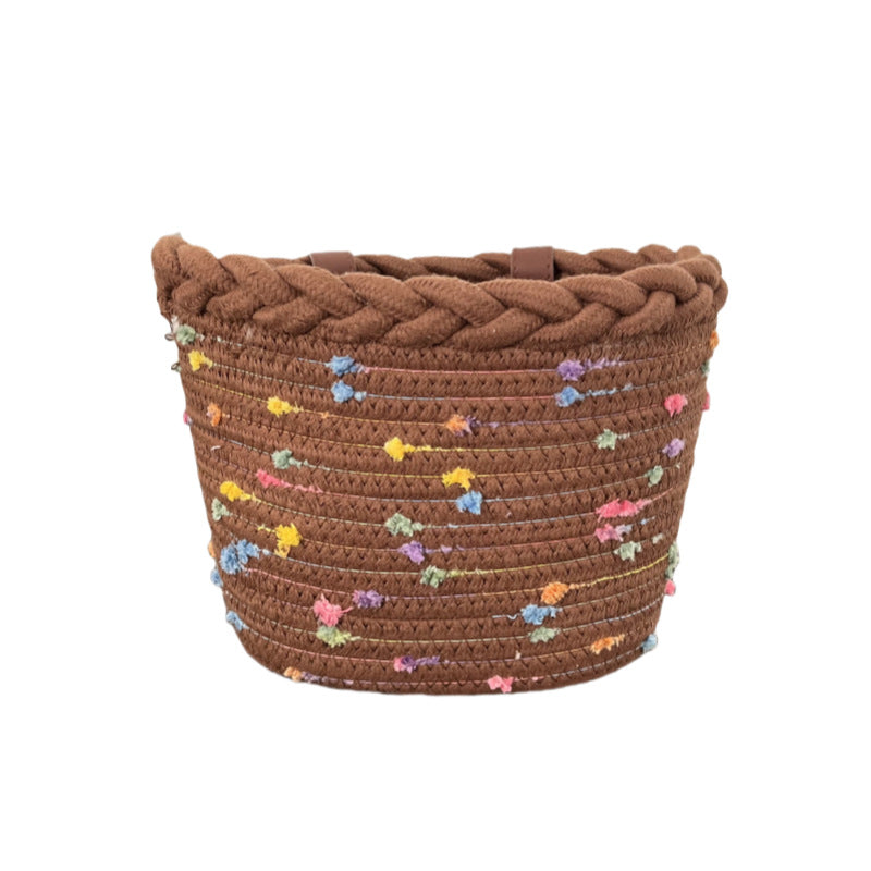 braided rope bike basket with pom pom embellishments and leather handlebar straps Stornfield