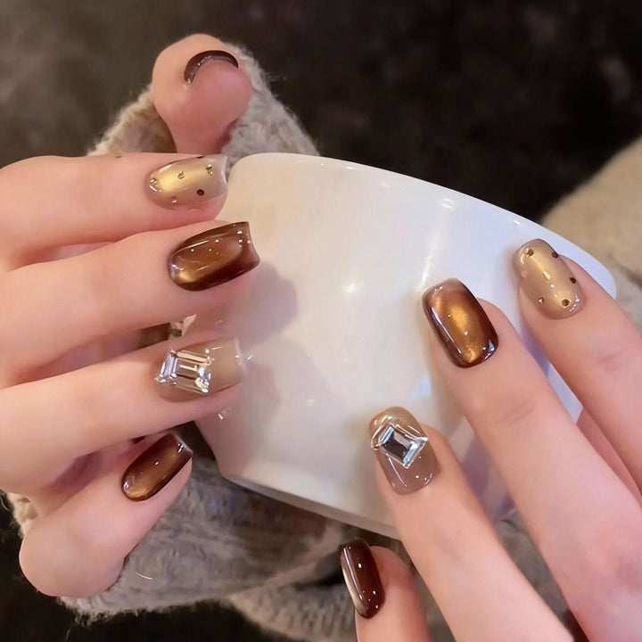 Acrylic nail set with elegant ombre designs and sparkling accents Stornfield