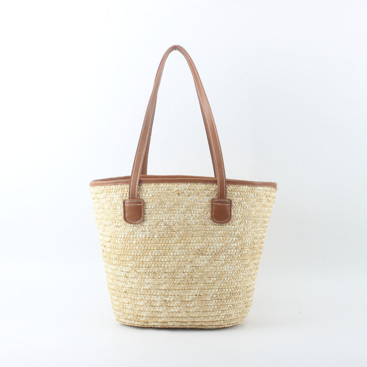 Braided basket bag with elegant leather handles Stornfield