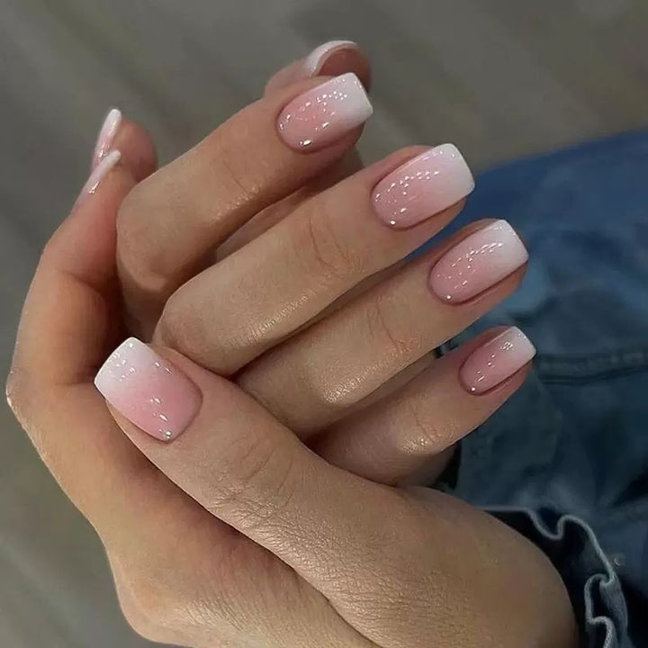 Acrylic nail set with elegant ombre design and glitter accents Stornfield